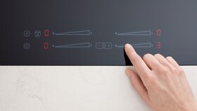 Le bouton marche-arrêt sur un plan de cuisson à induction Electrolux
